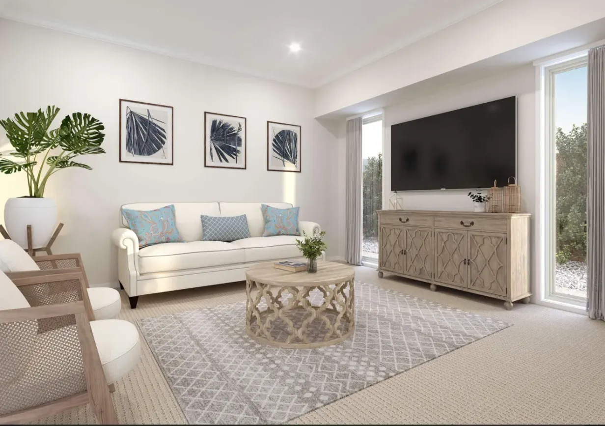 Staged living room at Navo Park Ridge with neutral furnishings and gallery wall art