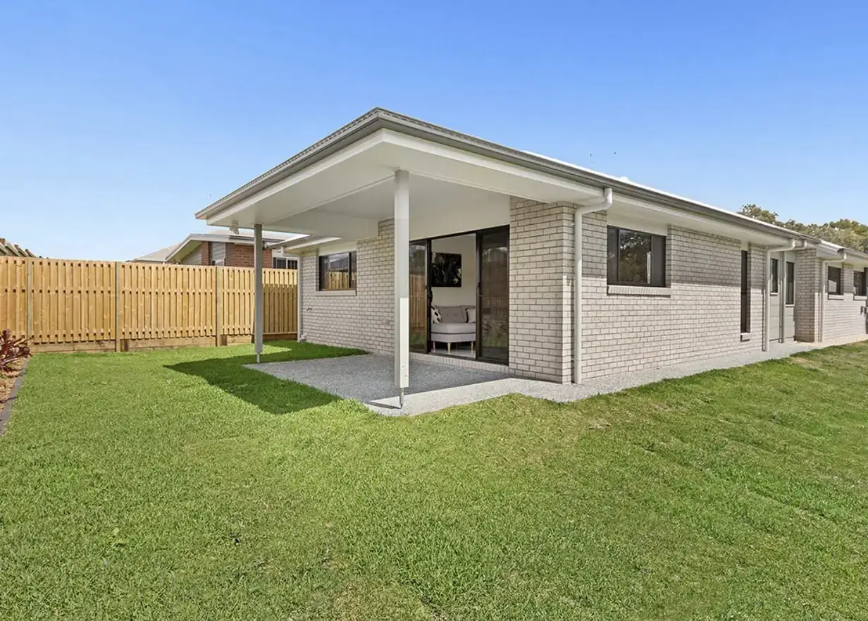 Brick single-storey home with covered alfresco patio and timber fencing