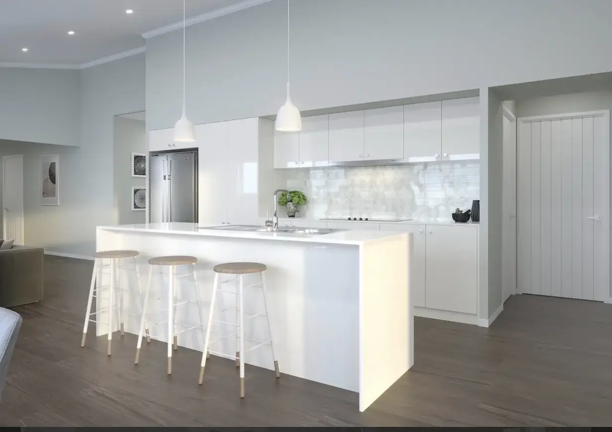 White gloss kitchen with waterfall-edge island, three bar stools and pendant lighting